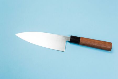 knife lies on a colored background. Professional cook knife.の写真素材