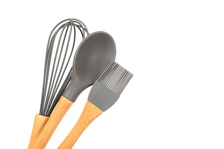 Set of kitchen utensils with wooden handles isolated on white backgroundの写真素材