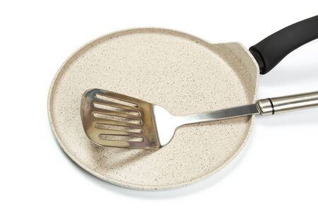 Photo of a bright ceramic pan with a black handle, isolated on a white background. Studio shotの写真素材