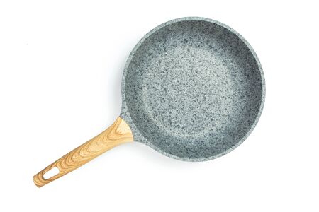 Photo of a ceramic frying pan with a wooden handle isolated on a white background.の写真素材