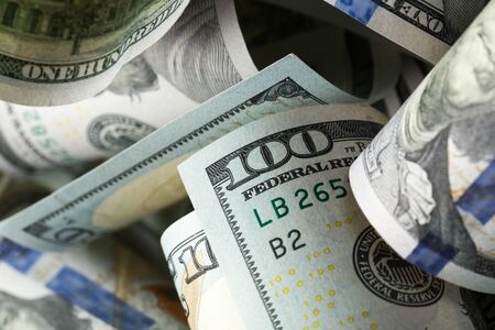 American dollars. A stack of hundred dollar bills. Close up of new hundred dollar bill on the white background.の写真素材