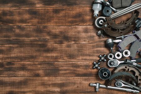 Various car parts  
 on wooden backgroundの写真素材