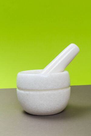 white porcelain mortar on a gray tableの写真素材