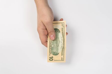 woman hand with dollars isolated on a white backgroundの写真素材
