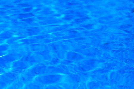 surface of blue swimming pool,background of water in swimming poolの写真素材
