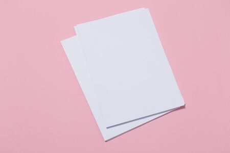 top view of a open notebook on a pink background. Office notepad flat layの写真素材