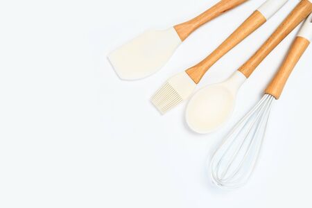 Set of kitchen utensils with wooden handles isolated on white backgroundの写真素材