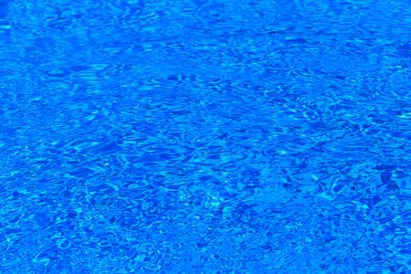 surface of blue swimming pool,background of water in swimming poolの写真素材