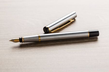 fountain pen on wooden tableの写真素材