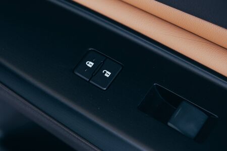 Front and back electric windows buttons-lower or close car windows. Leather upholstery, chrome and silver ornaments. Adjustable folding mirrors left and right.の写真素材