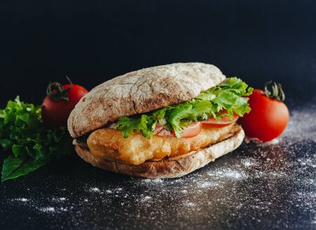 grilled sea fish with lemon wedges street food in boxの写真素材