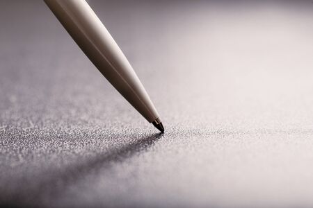 automatic plastic ballpoint pen with clipping path on black background. close up.