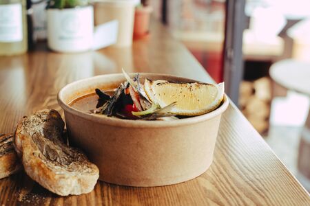 Fresh hot fish soup with ingredients and spices for cooking.の写真素材