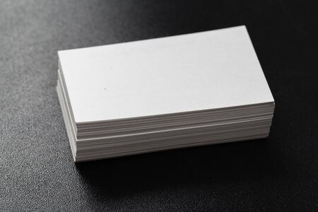Mockup of business cards at dark background.
