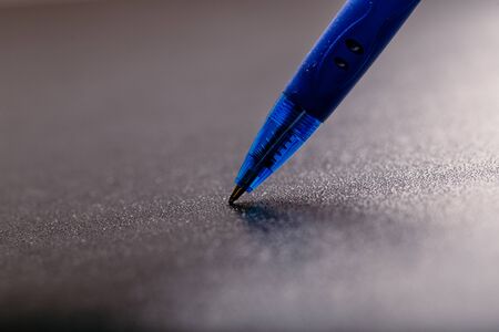 automatic plastic ballpoint pen with clipping path on black background. close up.