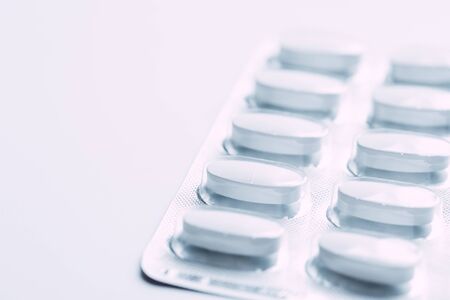 Pills in blister packs isolated on white backgroundの写真素材