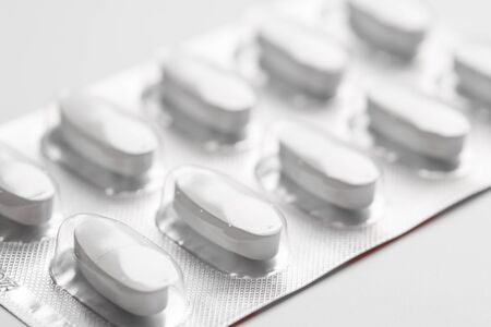 Pills in blister packs isolated on white backgroundの写真素材