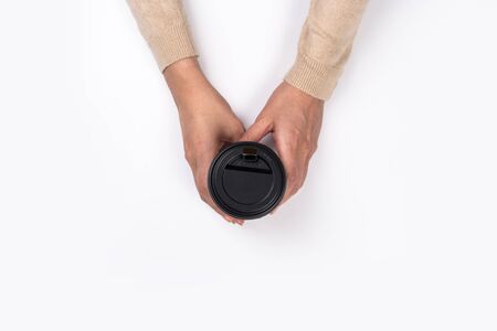 Female hand with paper cup isolated on white. Flat lay