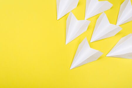 Travel plane concept.Mockup design of travel concept with group airplane on Yellow color background with space for copy spaceの写真素材