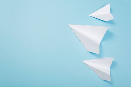 Travel plane concept.Mockup design of travel concept with group airplane on blue color background with space for copy spaceの写真素材