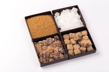 various types of sugar - brown, white, granulated, cane sugar.isolatedの写真素材