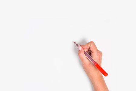 Female hands hold a pen. Isolated on white background. copy space, template.
