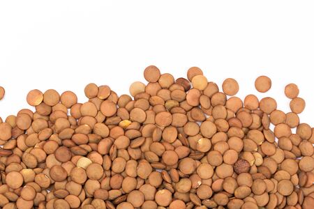 Close up brown lentil seeds background. Healthy vegeterian food.の写真素材