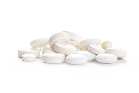Piles of pills and capsule on white background, isolated. Selective focusの写真素材