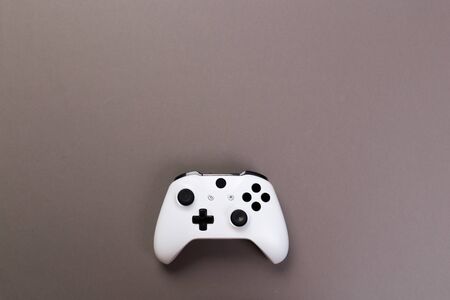 Joystick gaming controller isolated on gray background , Video game console developed Interactive Entertainmentの写真素材