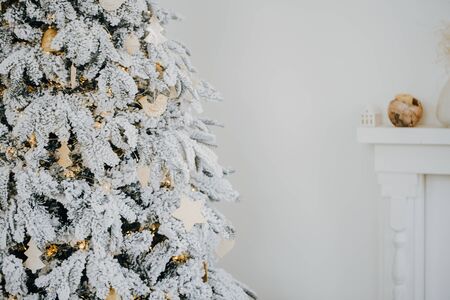 Christmas decorations on Christmas tree with lightsの写真素材