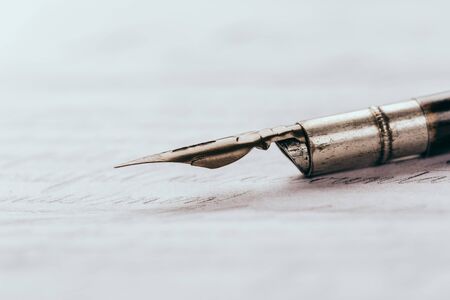 Fountain pen on an ancient handwritten letter. Old story. Retro style.の写真素材