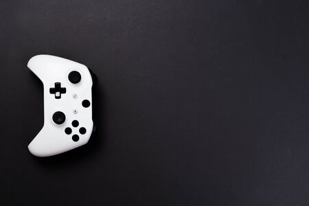 Joystick gaming controller isolated on black background , Video game console developed Interactive Entertainmentの写真素材