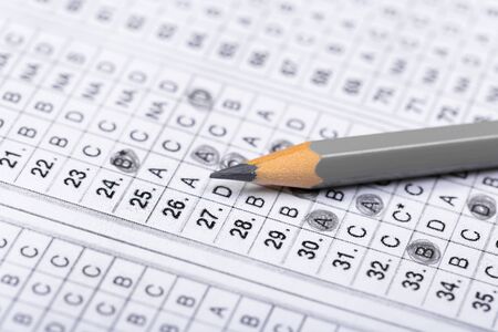 testing in exercise and exam paper. computer sheet with pencil in school test room, education conceptの写真素材