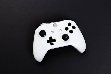 Joystick gaming controller isolated on black background , Video game console developed Interactive Entertainmentの写真素材
