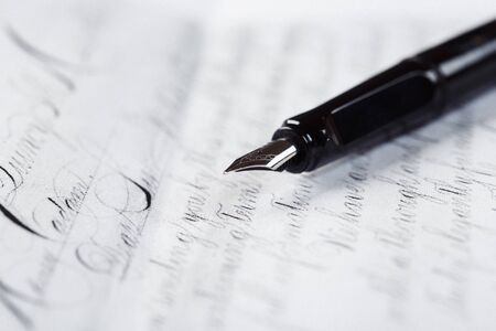 fountain pen on paper with ink text closeupの写真素材