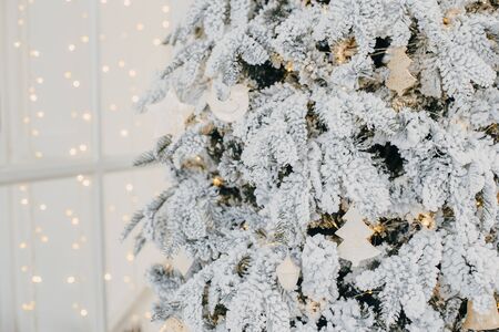 Christmas decorations on Christmas tree with lightsの写真素材