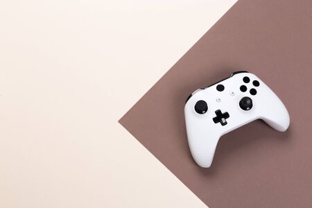 Joystick gaming controller isolated on colorful background , Video game console developed Interactive Entertainmentの写真素材