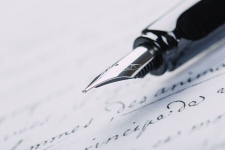 fountain pen on paper with ink text closeupの写真素材