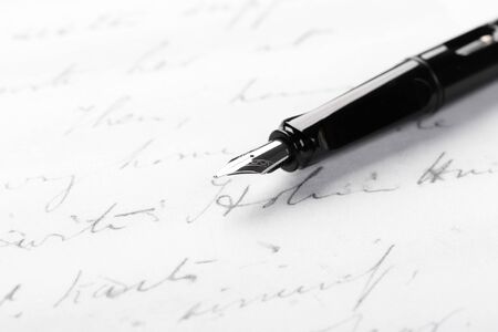 fountain pen on paper with ink text closeupの写真素材