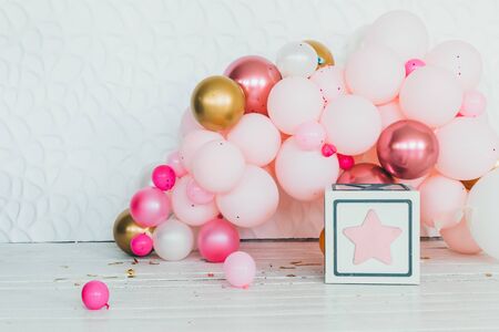 pink gold and beige balloons photo wall decoration for birthday or partyの写真素材