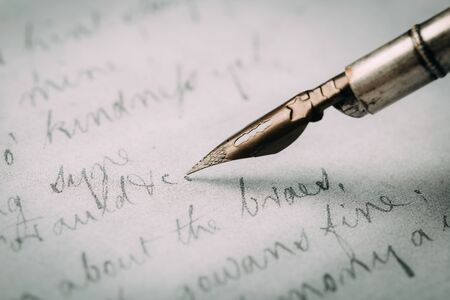 Fountain pen on an ancient handwritten letter. Old story. Retro style.の写真素材