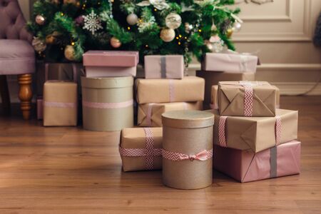 Christmas and New Year decorations with lights.Christmas tree and gift boxes left by santa clausの写真素材