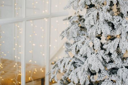 Christmas decorations on Christmas tree with lightsの写真素材