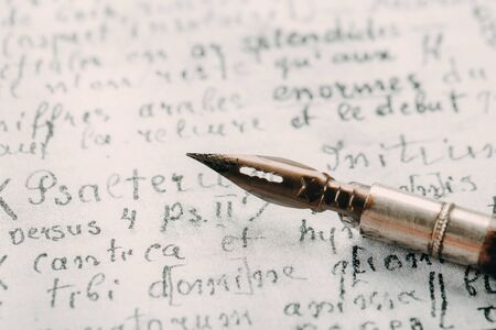 Fountain pen on an ancient handwritten letter. Old story. Retro style.の写真素材