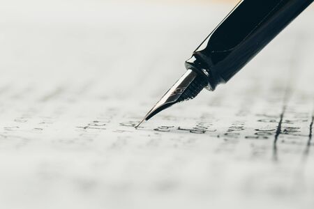 fountain pen on paper with ink text closeup