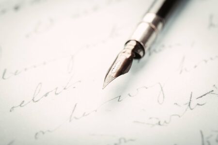 fountain pen on paper with ink text closeupの写真素材