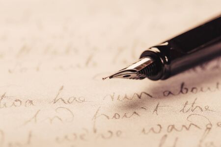 fountain pen on paper with ink text closeupの写真素材