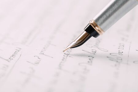 fountain pen on paper with ink text closeup