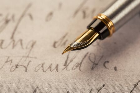 fountain pen on paper with ink text closeupの写真素材