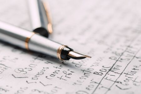 fountain pen on paper with ink text closeupの写真素材